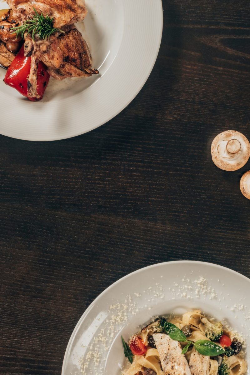 top view of dishes with meat and fish at restaurant
